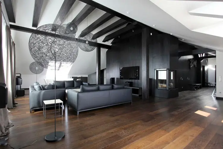 Living room with wooden floors and black furniture