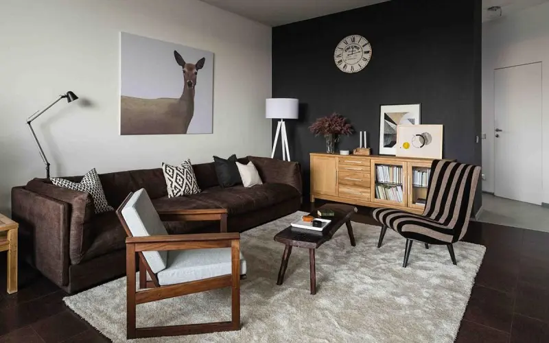 Dark Brown Sofa paired with black and white walls and furniture