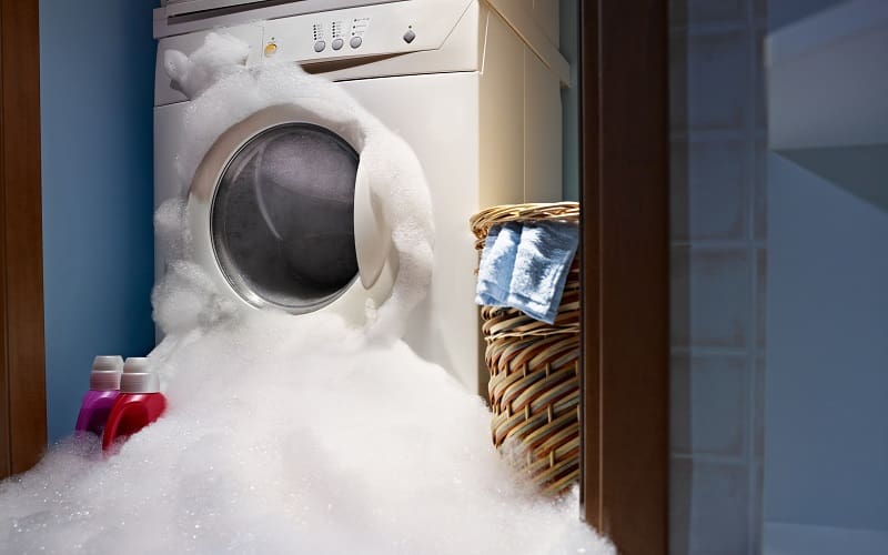 Soap coming out from broken washing machine