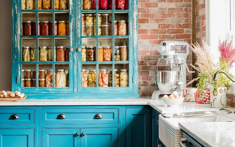 Teal Kitchen with Brick Wall