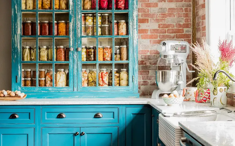 Teal Kitchen with Brick Wall